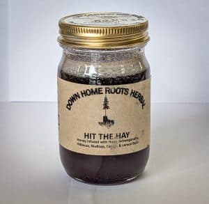 Down Home Roots Herbal Hit The Hay honey jar with herbal ingredients.