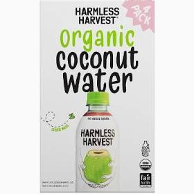 Harmless Harvest organic coconut water bottle with green cap and label.