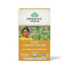 Organic India Tulsi Lemon Ginger tea box with a smiling woman in a garden.