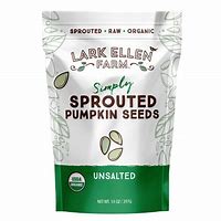 Sprouted pumpkin seeds in a white and green package from Lark Ellen Farm.