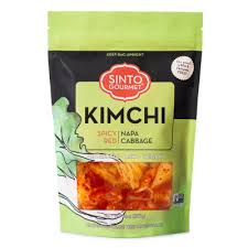 Spicy red kimchi in green and black packaging for healthy roots.