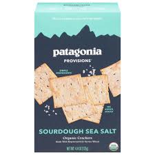 Organic sourdough sea salt crackers in a box, healthy snack option.