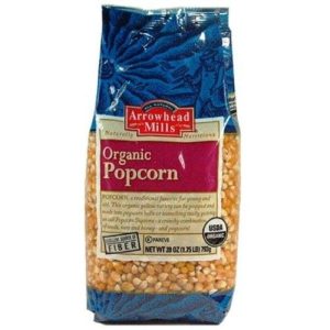 Organic yellow popcorn in a blue and pink bag for healthy snacking.
