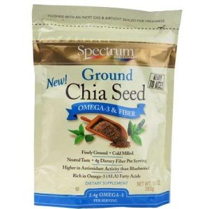 Organic ground chia seed in a resealable bag with blueberries and leaves.