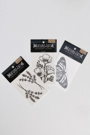 Assorted small nature-themed temporary tattoos on white background.