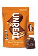 Unreal Caramel Peanut Nougat Bars in a bag with one bar outside.