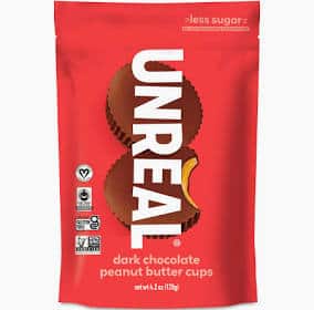 Unreal dark chocolate peanut butter cups in red packaging for healthy snacking.