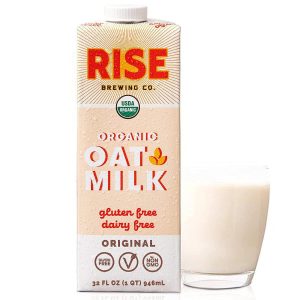 Rise Organic Oat Milk 32oz bottle with glass of oat milk.