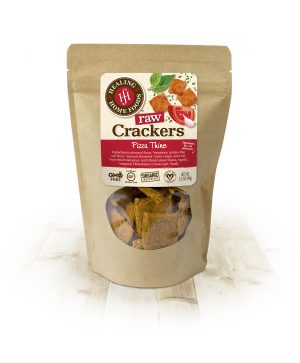 Healthy Roots raw crackers pizza thins in a resealable bag on a white surface.