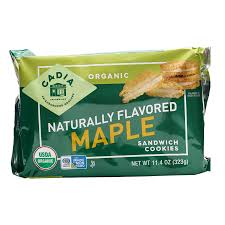 Cadia Organic Maple Sandwich Cookies on green packaging.