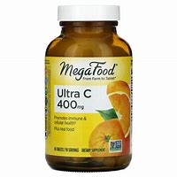 Megafood Ultra C-400 mg dietary supplement bottle with oranges and lemon.