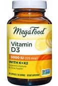 Vitamin D3 supplement bottle with Megafood label and yellow cap.