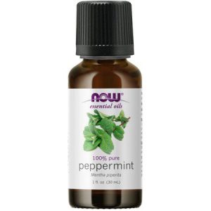 Pure peppermint essential oil in a small amber bottle with black cap.