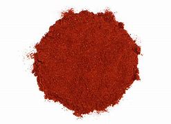 Smoked paprika spice in a pile, vibrant red color for cooking and seasoning.