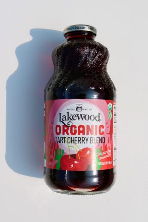 Organic tart cherry juice in a 32oz bottle with colorful label.