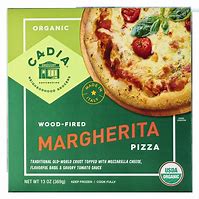 Wood-fired Margherita pizza with fresh basil and tomatoes, perfect for pizza lovers.