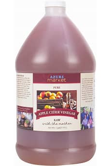 Organic apple cider vinegar in a large gallon bottle for health and wellness.