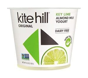 Kite Hill Key Lime Almond Milk Yogurt in a cup with lime slice.