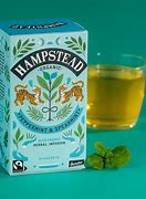 Hampstead organic peppermint and spearmint tea box with a glass of brewed tea.