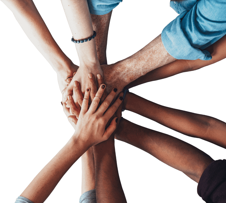 Diverse group of hands stacked together symbolizing unity and teamwork in Michigan real estate.