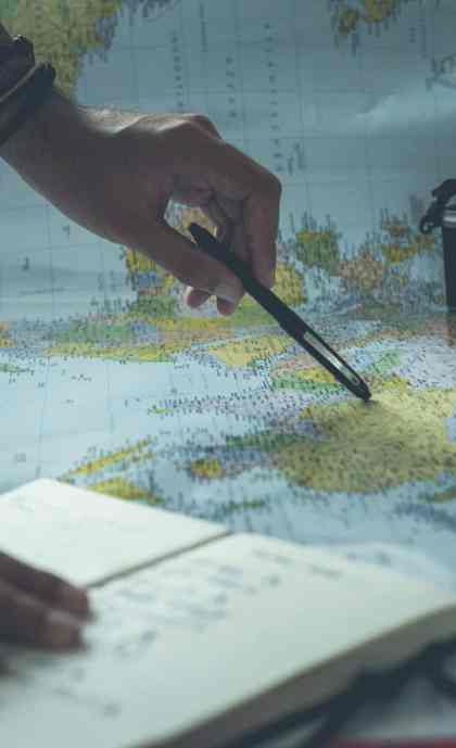 Trip planning with map and notebook