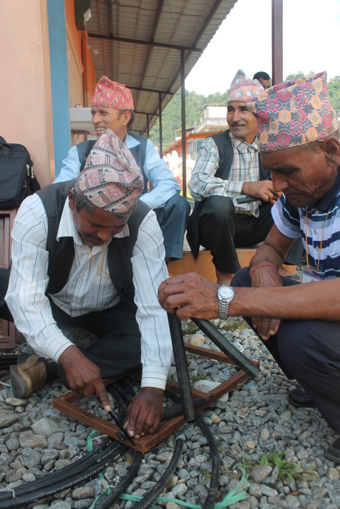 Participants assemble tap stands - a useful skill for any community with a SolarMUS.