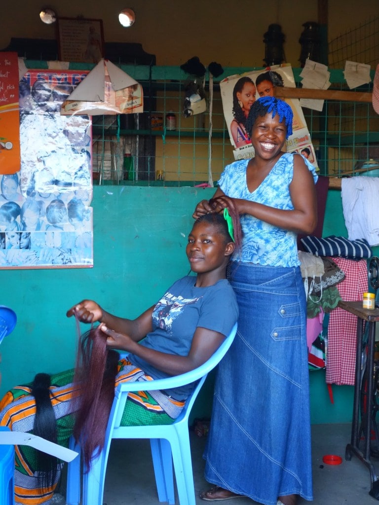 Linet at work in her hairdressing salon in Got Kachola