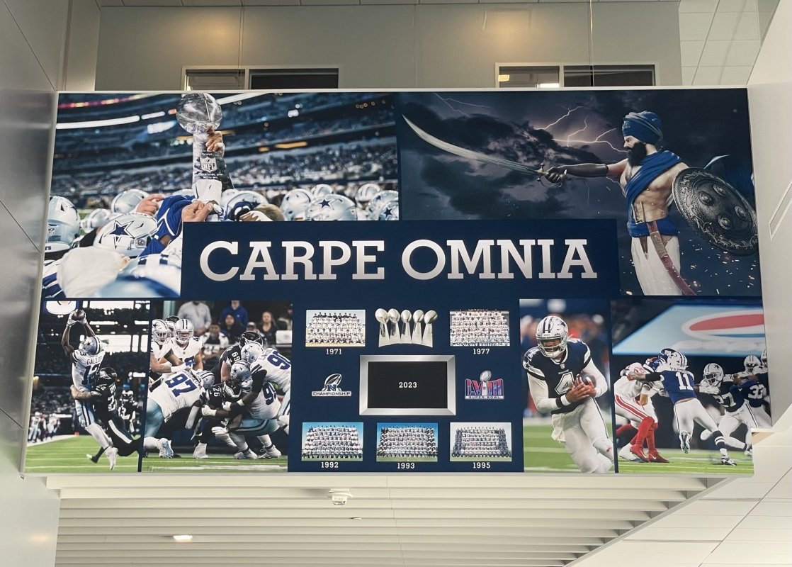 New Cowboys sign " Carpe Omnia" near the locker room