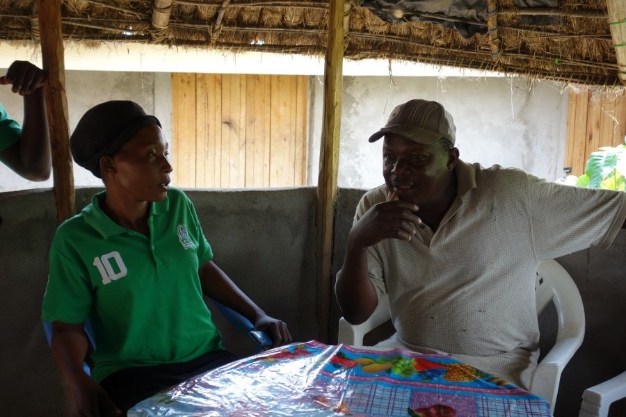Diana in discussion with a community member.