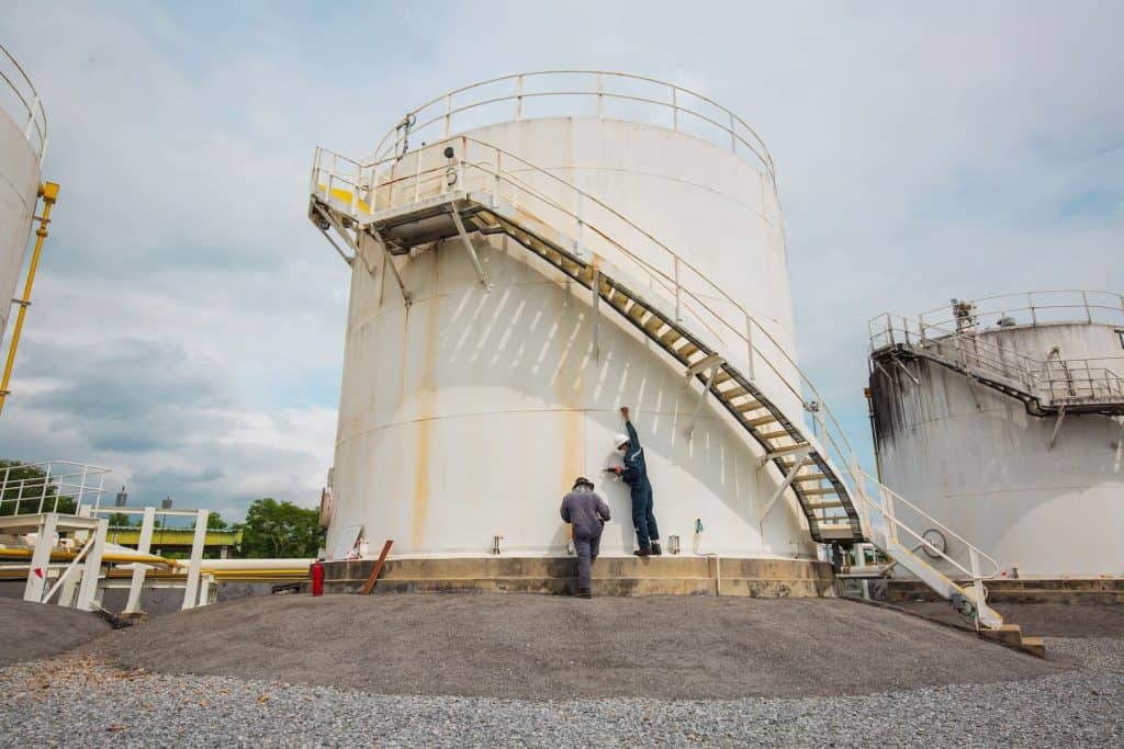 Inspection of large storage tanks for safety and compliance.