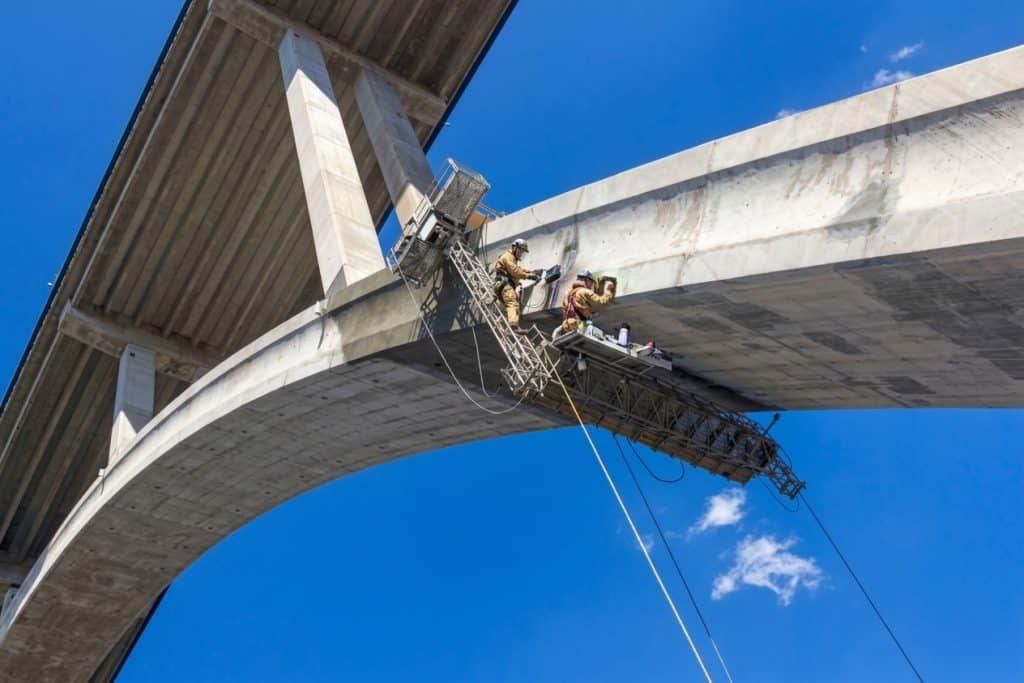 Bridge & DOT Inspection in progress on a large concrete bridge.
