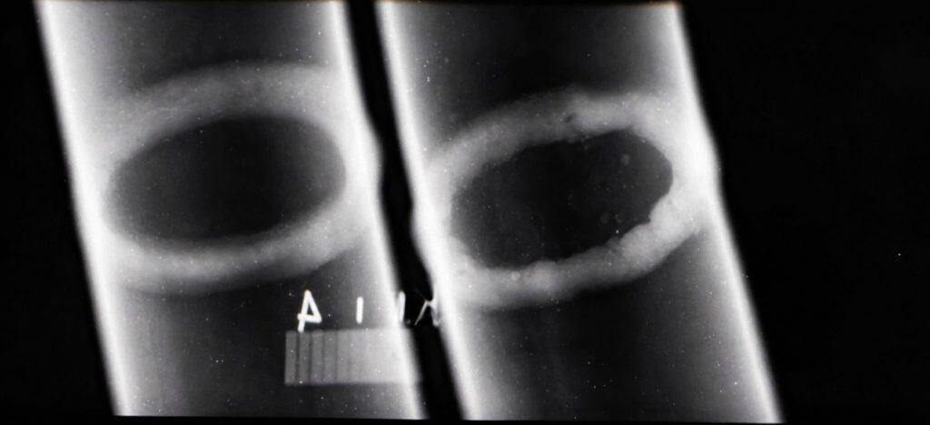 X-ray image showing internal inspection of metal parts for flaws and defects.