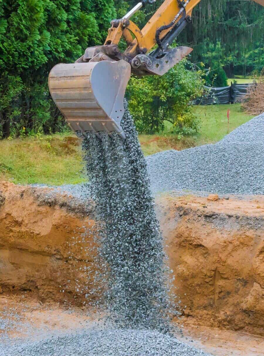 crane scooping gravel
