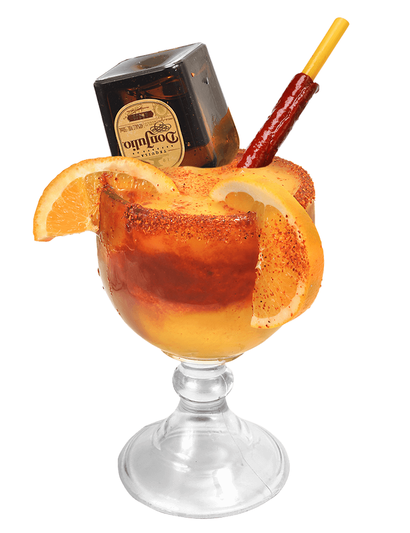 Margarita Mangoneada with orange slices, tamarind candy, and chili powder rim.