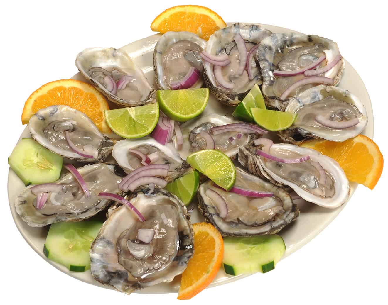 Fresh oysters served with lime, lemon, cucumber, and onion slices.