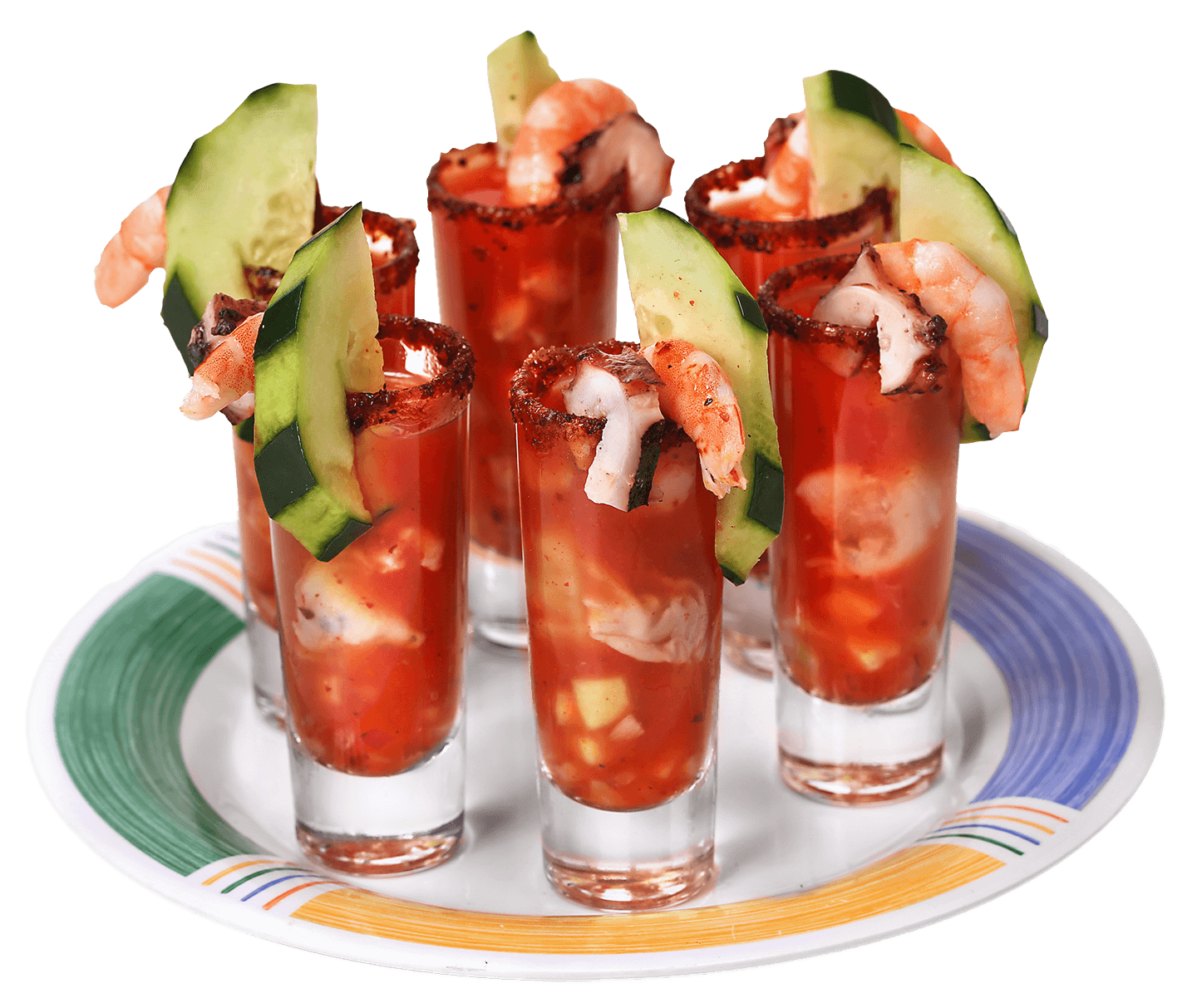 Seafood shots with shrimp, cucumber, and tomato-based sauce in small glasses.