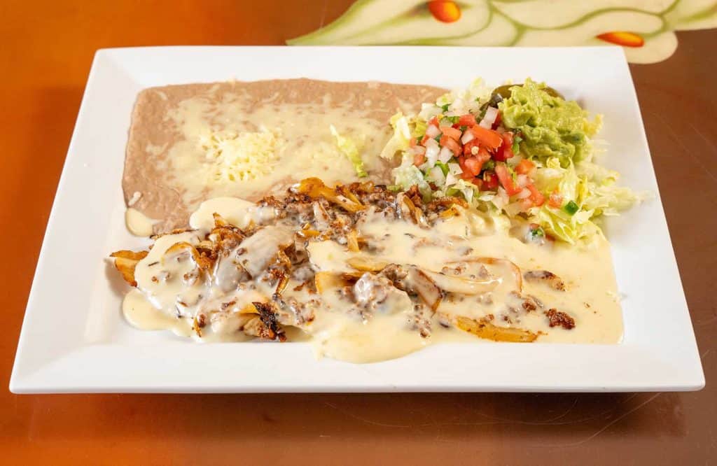 Pollo Loco is one of the many authentic dishes that Los Tres Amigos offers customers when they are looking at choices for Mexican catering and spring party planning in Northville MI.