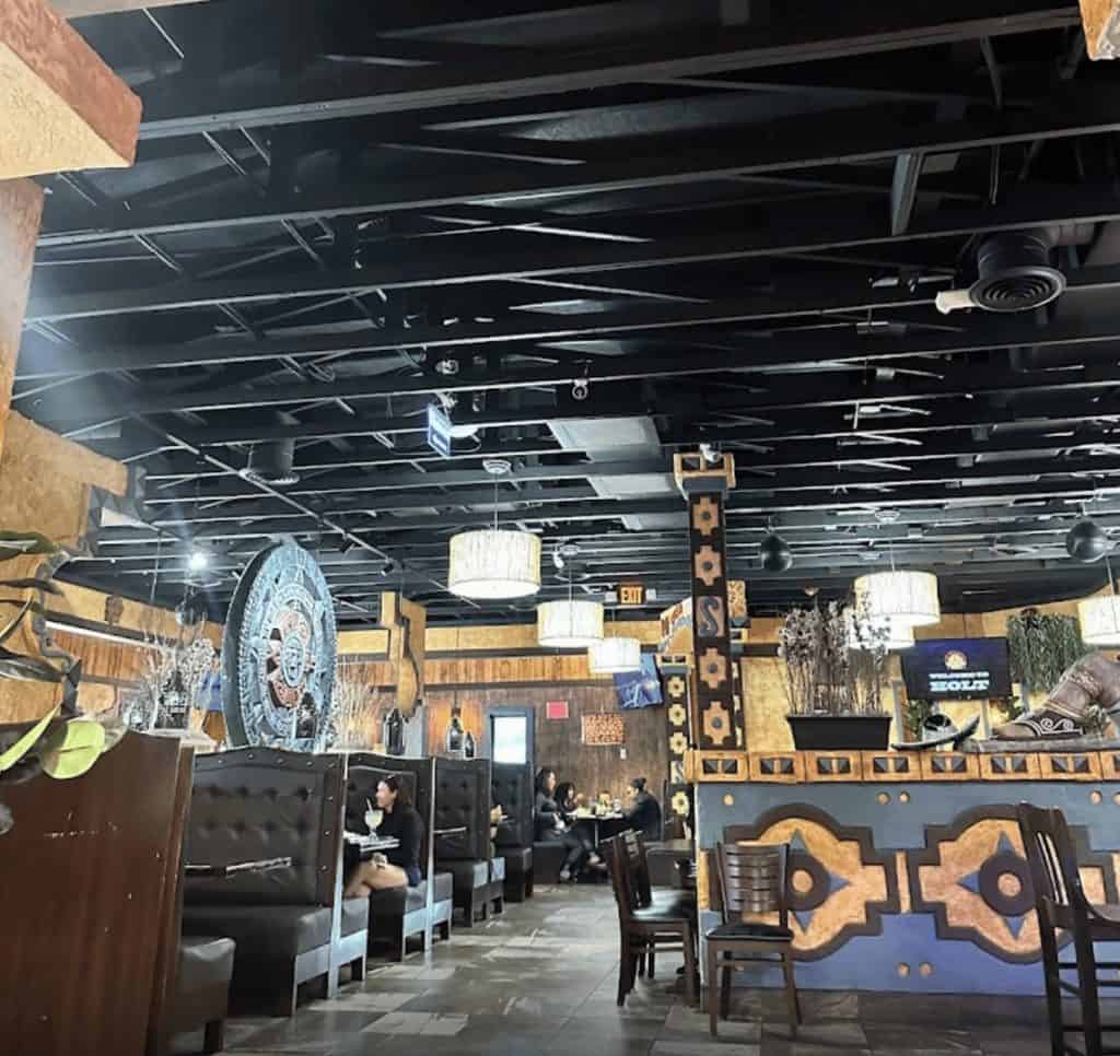 Interior of a modern restaurant with stylish decor and cozy seating.