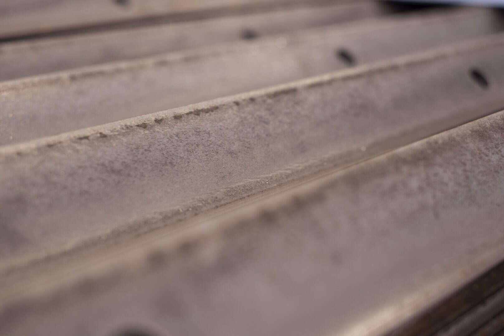 Close-up of metal parts with precise machining marks from Lynch's Metal Fab.