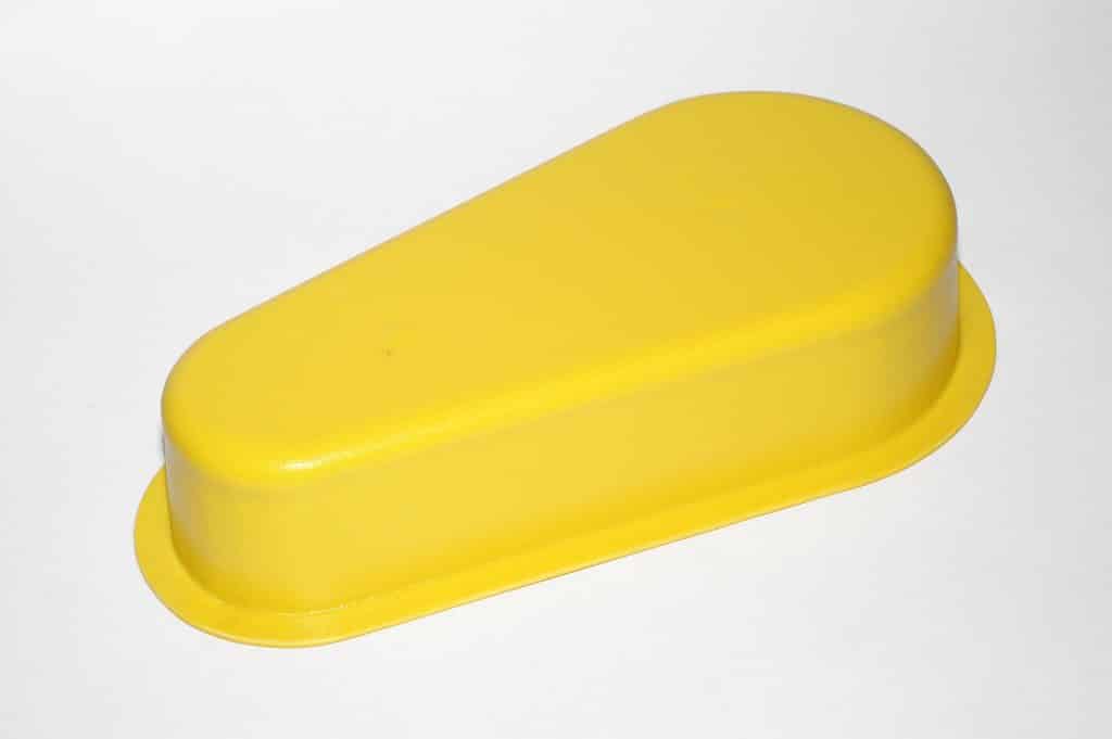 Yellow safety cover for machinery protection and safety enhancement.