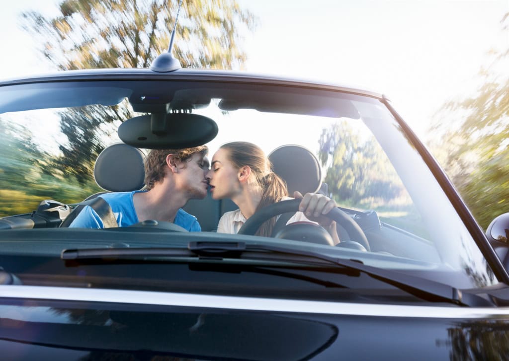 Distracted drivers seen through windshield