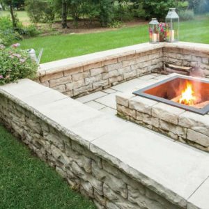 Fire pit with stone surround for outdoor entertainment and relaxation.