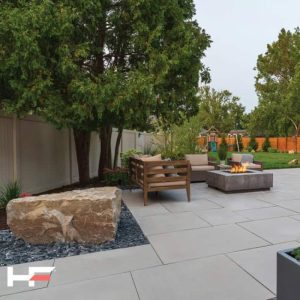 Outdoor patio with seating and fire pit for relaxing and entertaining.