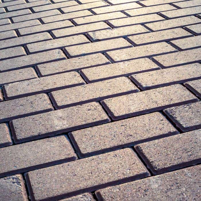 Brick pavement for outdoor walkway or street surface.