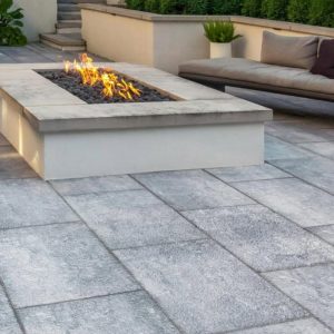 Fire pit with modern outdoor seating on a patio.