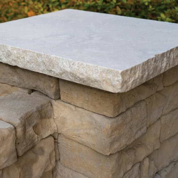 Close-up of a stone table top with a natural finish for outdoor use.