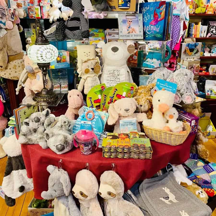 display table full of plush stuffed animals