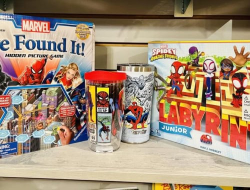 Spider-Man LEGO set and Marvel Spider-Man board game on shelf.