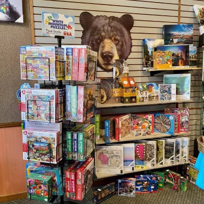 shelves and wall full of puzzles