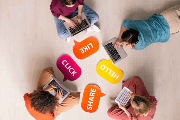 Group of friends sitting together and exploring social media.